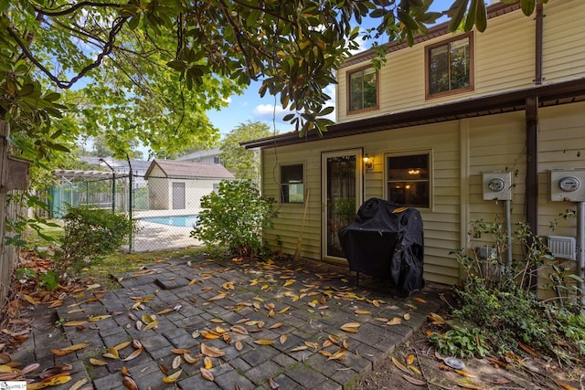 view of patio with grilling area and fence
