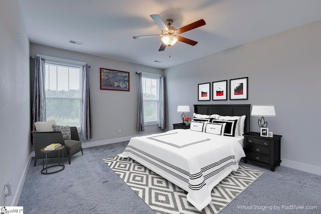 bedroom with carpet floors, baseboards, and a ceiling fan