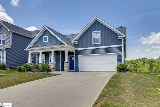 craftsman-style house with a garage, board and batten siding, a front lawn, and a porch