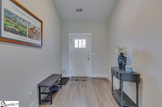 entrance foyer with wood finished floors and baseboards