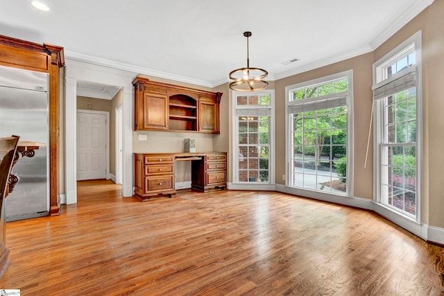 kitchen with built in fridge, light wood finished floors, crown molding, open shelves, and baseboards