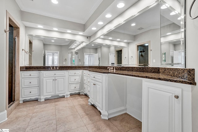bathroom with ornamental molding, a stall shower, recessed lighting, vanity, and tile patterned flooring