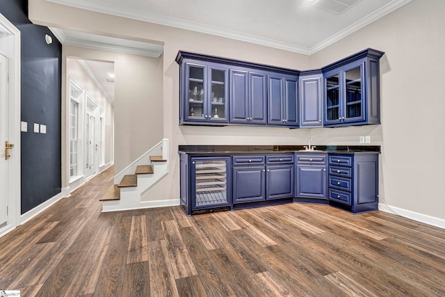 bar area with dark wood finished floors, wine cooler, crown molding, baseboards, and a sink