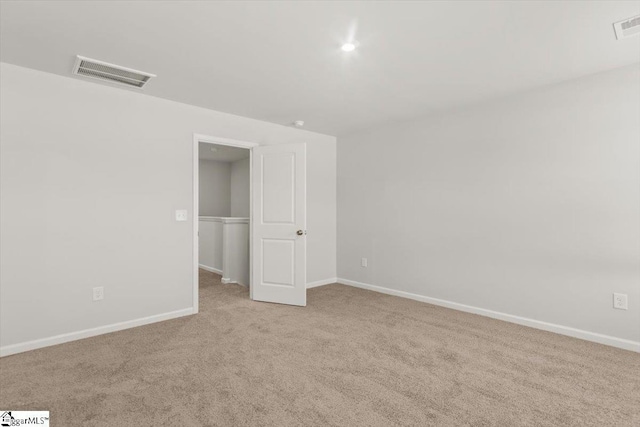 102 Randwick Ln, Greer, SC 29651 - unfurnished bedroom with carpet floors, baseboards, and a walk in closet