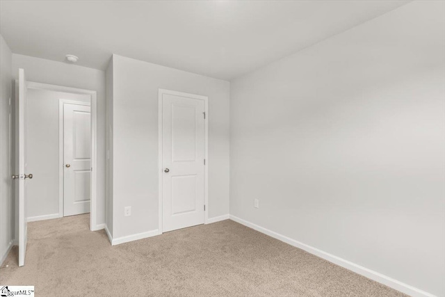 102 Randwick Ln, Greer, SC 29651 - unfurnished bedroom with light carpet and baseboards
