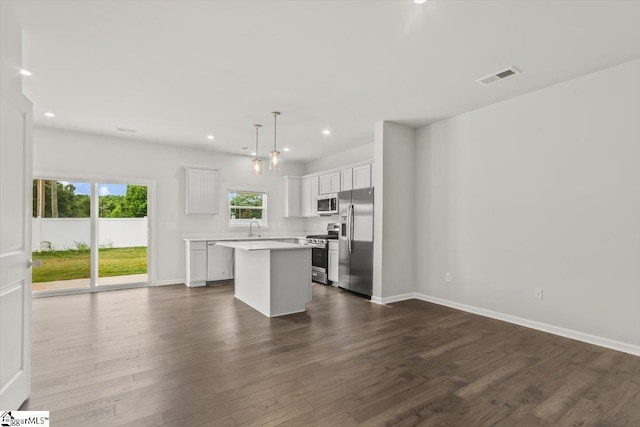 102 Randwick Ln, Greer, SC 29651 - kitchen featuring stainless steel appliances, a center island, recessed lighting, light countertops, and dark wood-style flooring
