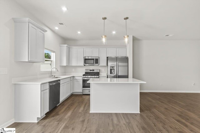 102 Randwick Ln, Greer, SC 29651 - kitchen with stainless steel appliances, a sink, dark wood-style flooring, baseboards, and light countertops