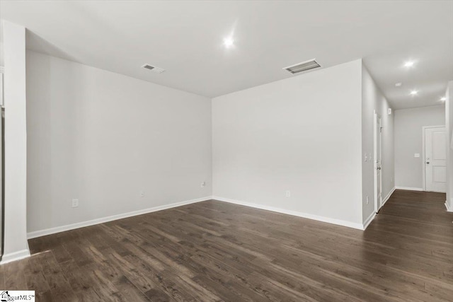 102 Randwick Ln, Greer, SC 29651 - spare room featuring dark wood finished floors, baseboards, and recessed lighting