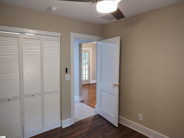 14 Dixie Ave, Greenville, SC 29607 - unfurnished bedroom featuring dark wood finished floors, a closet, and ceiling fan