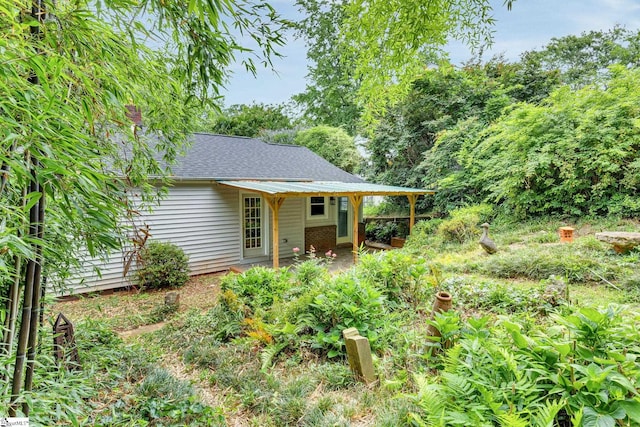 14 Dixie Ave, Greenville, SC 29607 - rear view of property featuring a shingled roof and a patio area