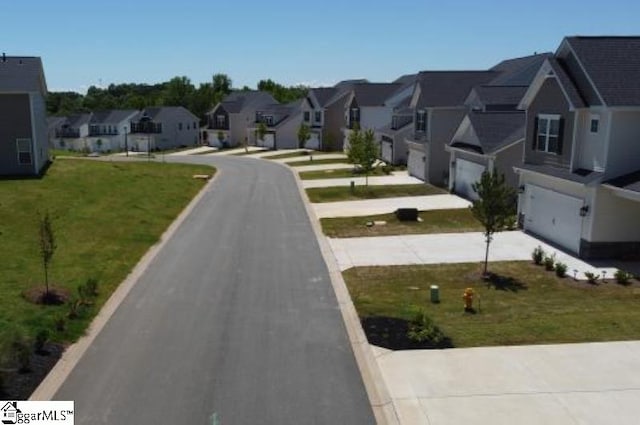view of asphalt road featuring a residential view