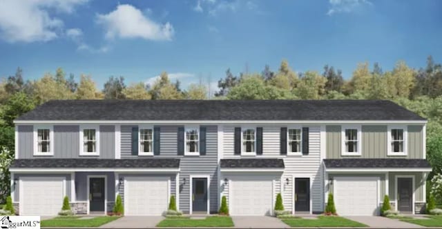 view of front of home featuring a garage, driveway, and a shingled roof