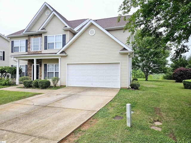 view of front facade with concrete driveway and a front lawn