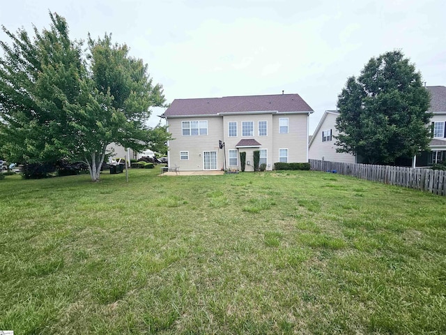back of house with a patio
