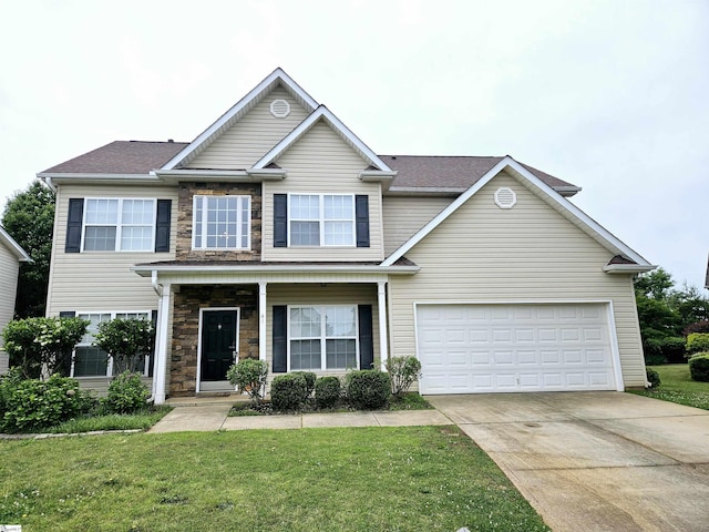 view of front of property with driveway, a front lawn, and stone siding