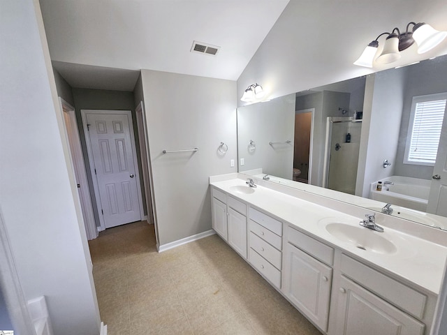 full bath with a shower stall, a garden tub, double vanity, baseboards, and toilet