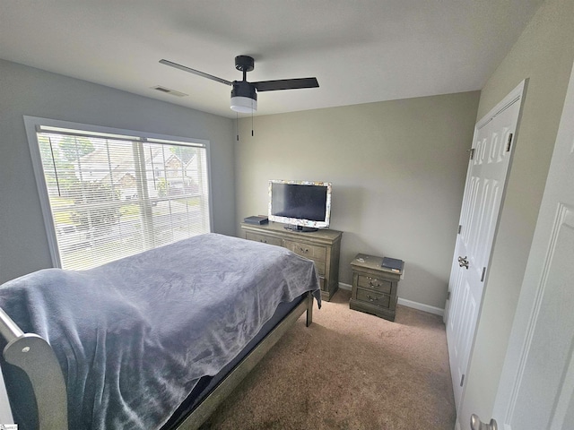 bedroom featuring carpet floors, baseboards, and a ceiling fan