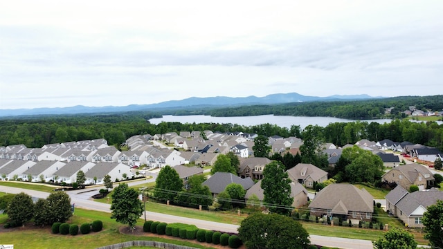 aerial perspective of suburban area featuring a water and mountain view