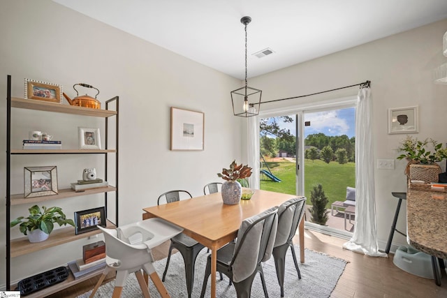 dining space with dark wood-type flooring