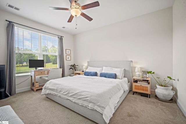 bedroom with carpet floors, baseboards, and a ceiling fan