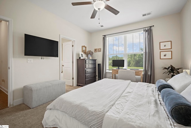 bedroom featuring carpet floors, baseboards, and a ceiling fan