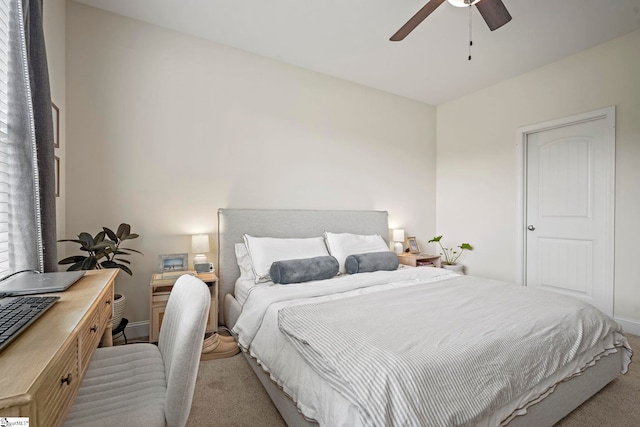 bedroom featuring carpet, a desk, ceiling fan, and baseboards