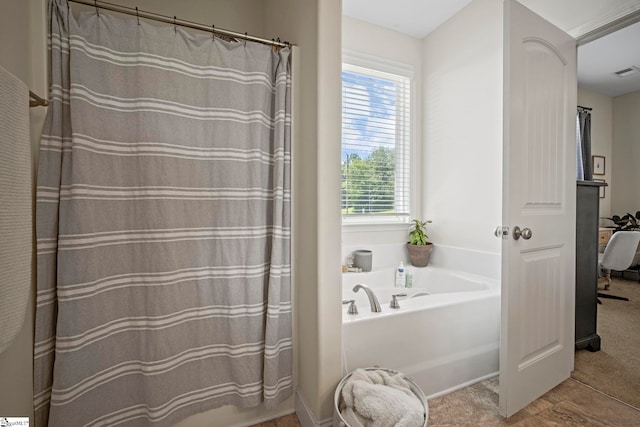 bathroom with a bath and curtained shower