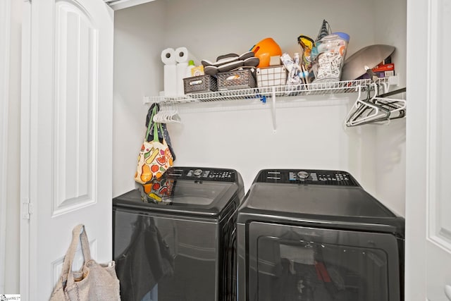 laundry area with washing machine and dryer