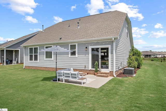 rear view of house featuring central air condition unit, a yard, a patio, and a shingled roof