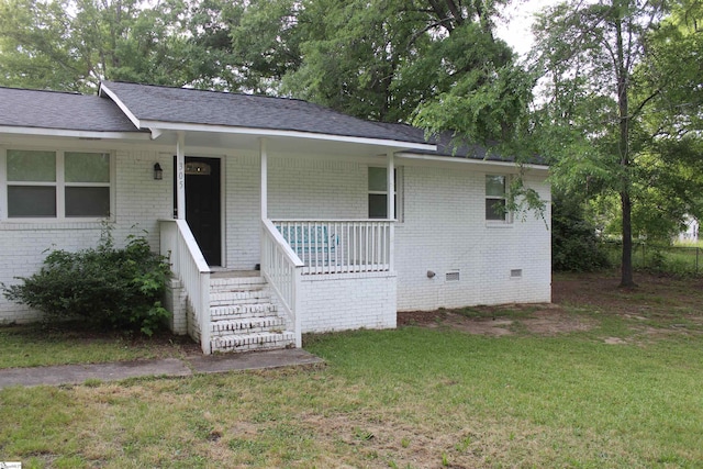 305 N Owens St, Clinton, SC 29325 - ranch-style house featuring brick siding, a porch, a front yard, roof with shingles, and stairs
