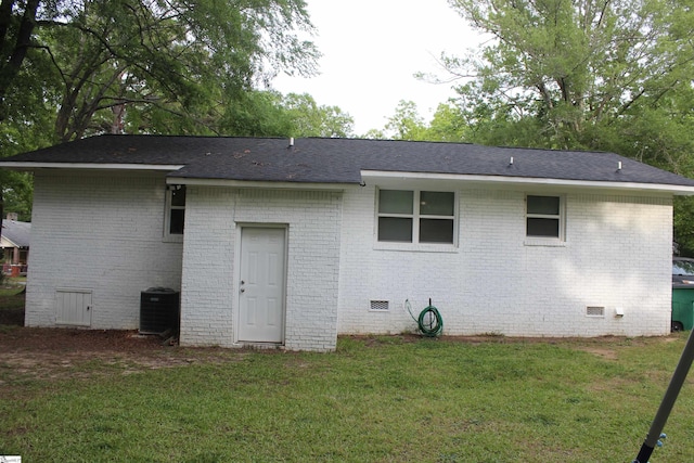 305 N Owens St, Clinton, SC 29325 - back of property featuring crawl space, central air condition unit, a lawn, and brick siding
