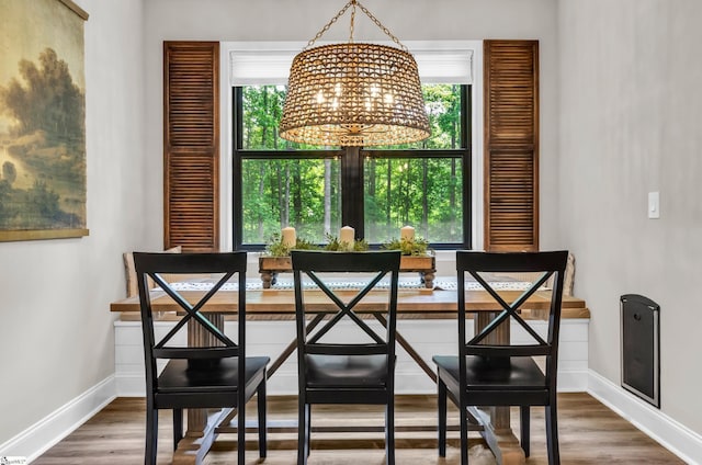203 N Hogan Dr, Westminster, SC 29693 - dining space featuring a chandelier, baseboards, and wood finished floors