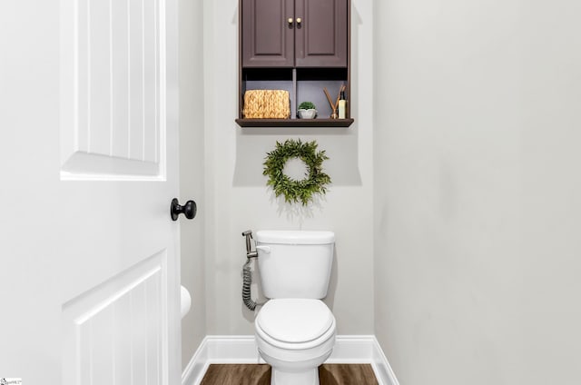 203 N Hogan Dr, Westminster, SC 29693 - bathroom with baseboards, wood finished floors, and toilet