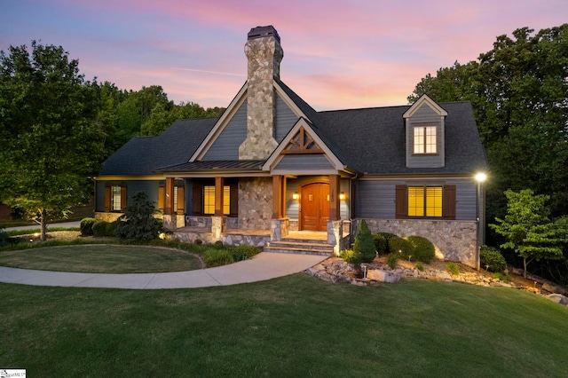 160 Mountain Brook Trl, Greenville, SC 29609 - view of front of house featuring stone siding, a porch, and a lawn