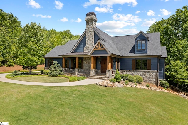 160 Mountain Brook Trl, Greenville, SC 29609 - view of front facade with covered porch, a front lawn, a chimney, and stone siding