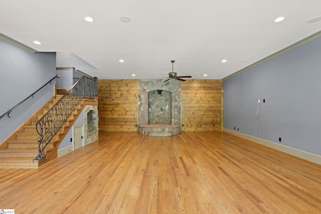 160 Mountain Brook Trl, Greenville, SC 29609 - unfurnished living room with a ceiling fan, recessed lighting, light wood-style floors, baseboards, and wood walls