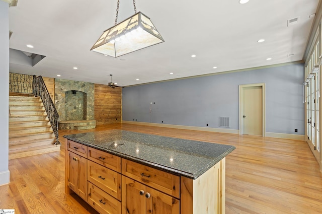 160 Mountain Brook Trl, Greenville, SC 29609 - kitchen with baseboards, recessed lighting, light wood-type flooring, a kitchen island, and dark stone counters