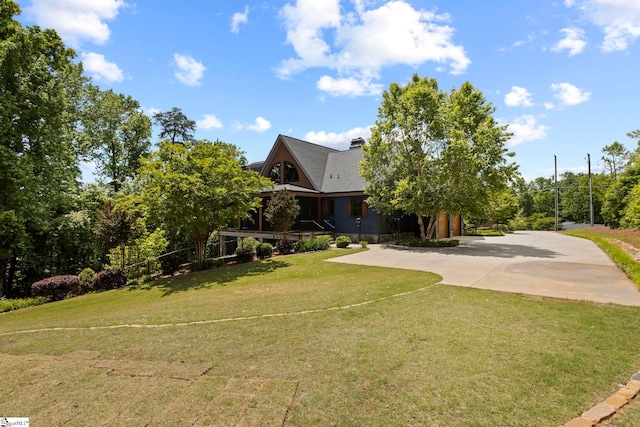 160 Mountain Brook Trl, Greenville, SC 29609 - view of front facade featuring a front lawn, a chimney, and driveway