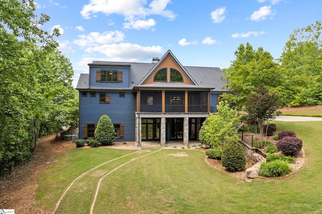 160 Mountain Brook Trl, Greenville, SC 29609 - back of house with a sunroom, a yard, central AC, and a shingled roof