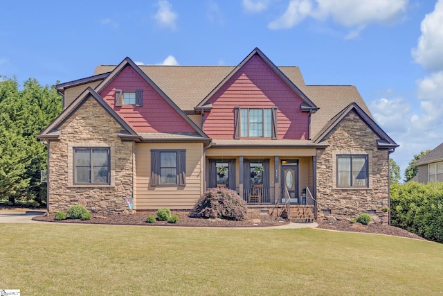 craftsman-style house with stone siding and a front yard