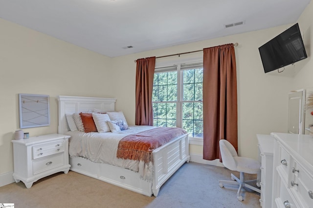 bedroom featuring light carpet