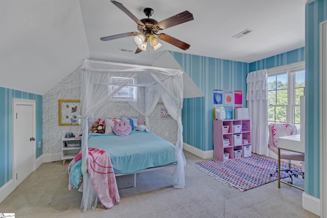 bedroom featuring wallpapered walls, carpet flooring, a ceiling fan, baseboards, and vaulted ceiling