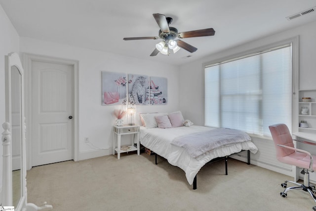 carpeted bedroom featuring a ceiling fan