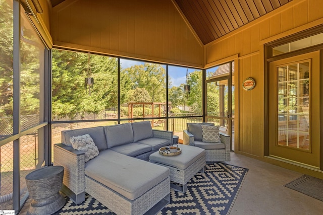 sunroom / solarium with an outdoor hangout area and lofted ceiling