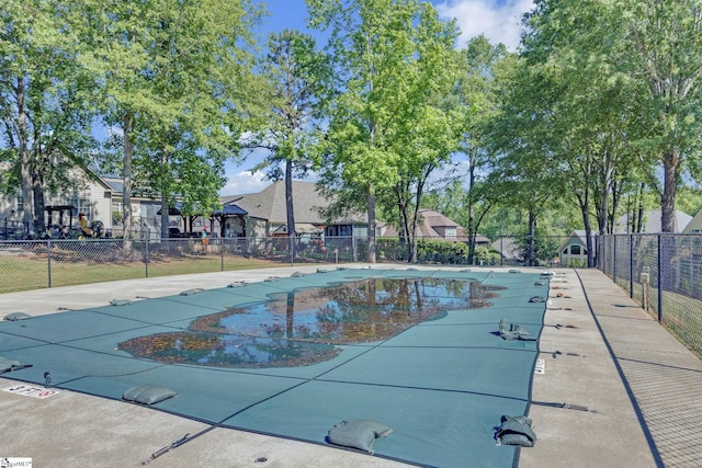 community pool featuring fence