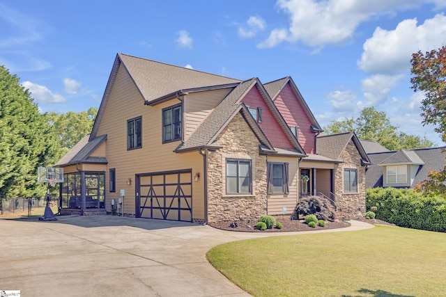 view of front of house with stone siding, a garage, driveway, and roof with shingles