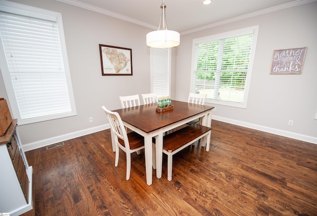 dining space with crown molding, dark wood finished floors, baseboards, and recessed lighting