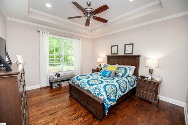 bedroom featuring a raised ceiling, dark wood-style flooring, baseboards, ornamental molding, and recessed lighting