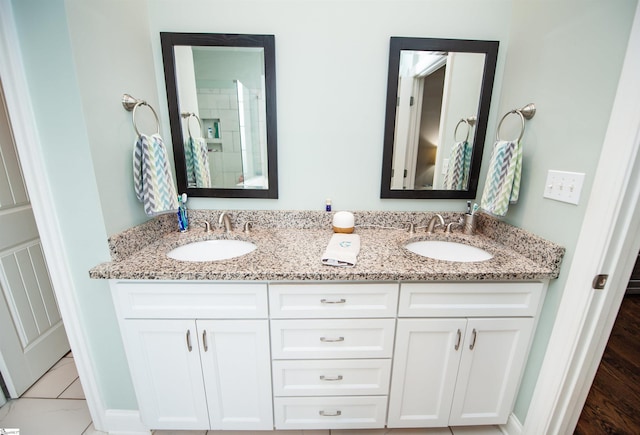 bathroom featuring double vanity
