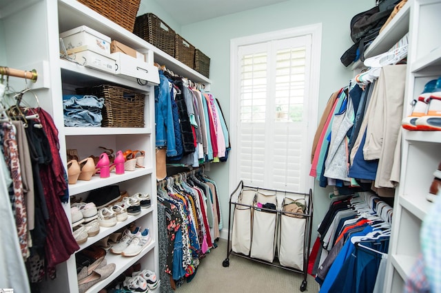 spacious closet with carpet flooring